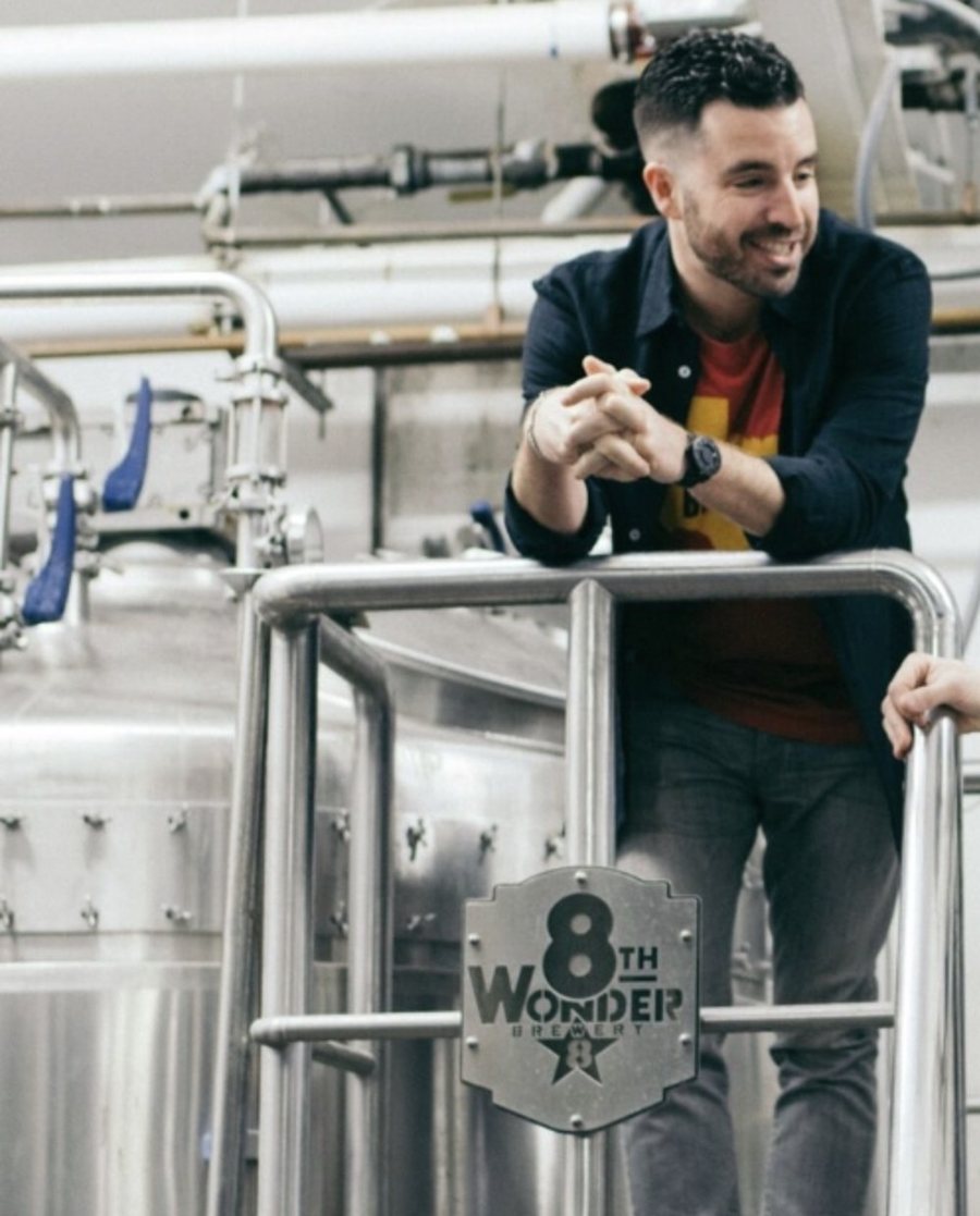 Ryan Soroka on the brewhouse platform at 8th Wonder Brewery